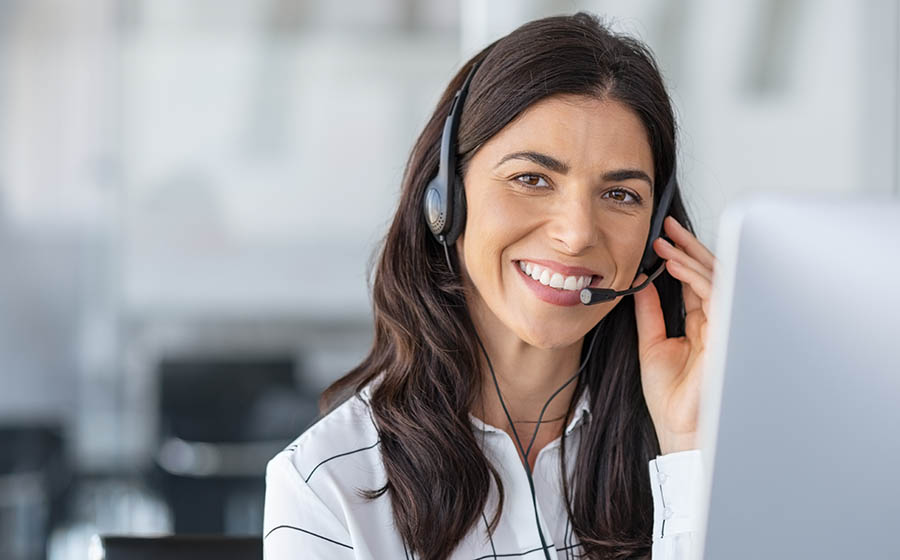 Happy smiling woman working in call center